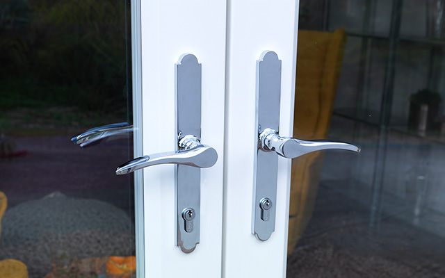 a close up of one of Evolution's door handle hardware options on their timber alternative French doors